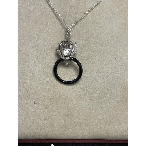 71 - A silver & cz designer style pendant necklace with emerald eyes