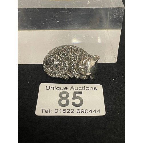 85 - A silver cat recumbent figure