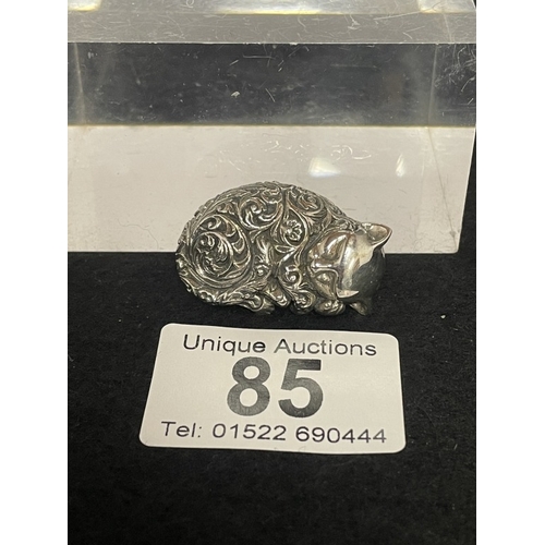 85 - A silver cat recumbent figure