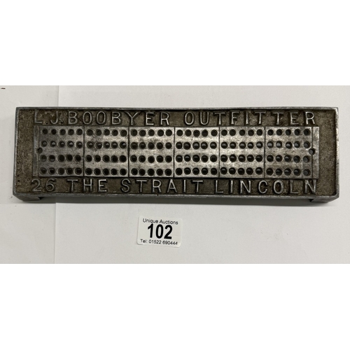 102 - An unusual metal cribbage board advertising L.J Boobyer outfitter, 26 The Strait Lincoln