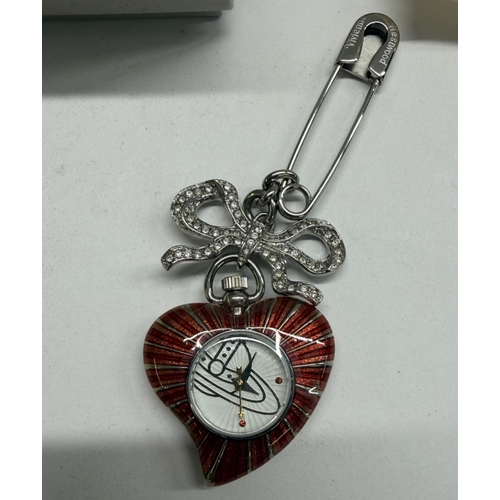 92 - A boxed Vivienne Westwood enamel heart watch brooch