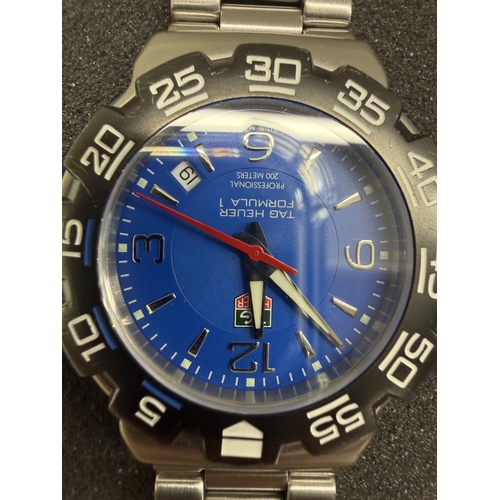 96 - A Tag Heuer Formula 1 quartz watch with blue face in case & service notes