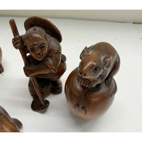 A collection of wooden Japanese netsuke