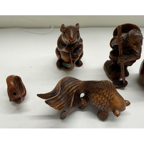 A collection of wooden Japanese netsuke