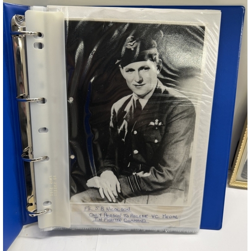 98 - A framed & glazed picture of RAF Lancaster Pilot Bill Reid & A folder of black & white photos & news... 