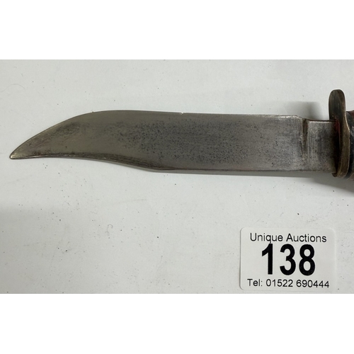 138 - A vintage hunting knife with leather sheath