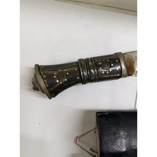 143 - An Indian kukri knife & sheath