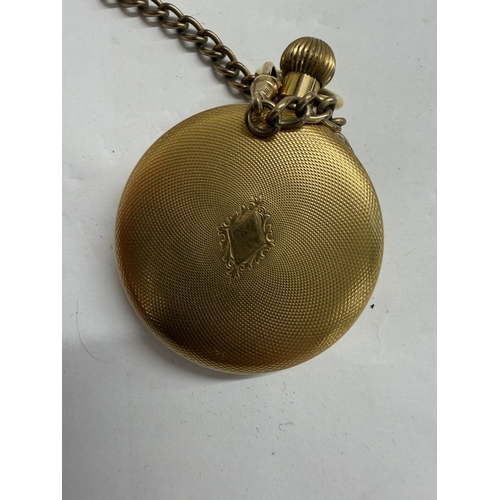 145 - An oak pocketwatch display stand with gold tone Limit 17 Jewels incabloc pocket watch & brass chain