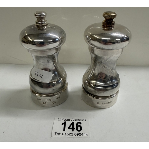 146 - A set of sillver salt & pepper pots (Gross weights 135.21 grams & 143.49 grams)