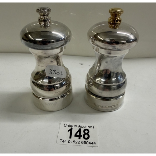148 - A set of silver salt & pepper pots (Gross weight 152.88 grams & 180.73 grams)