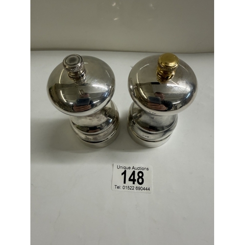 148 - A set of silver salt & pepper pots (Gross weight 152.88 grams & 180.73 grams)