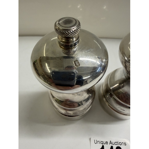148 - A set of silver salt & pepper pots (Gross weight 152.88 grams & 180.73 grams)