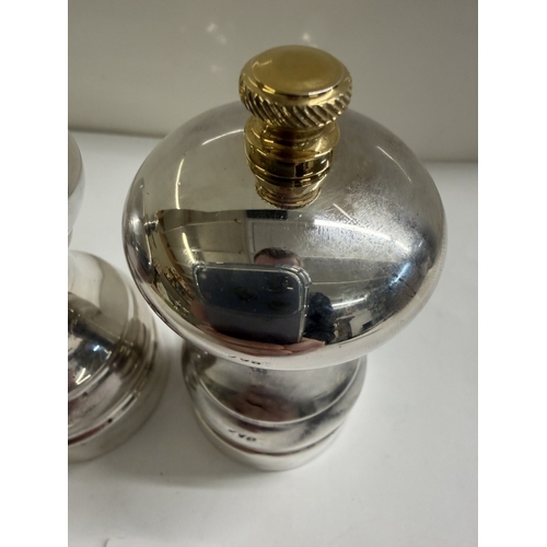 148 - A set of silver salt & pepper pots (Gross weight 152.88 grams & 180.73 grams)