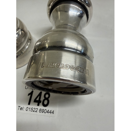 148 - A set of silver salt & pepper pots (Gross weight 152.88 grams & 180.73 grams)