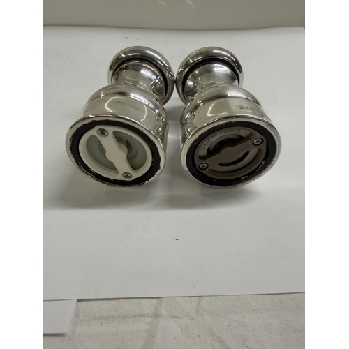 148 - A set of silver salt & pepper pots (Gross weight 152.88 grams & 180.73 grams)
