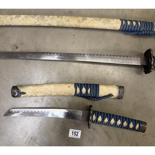 152 - A pair of Japanese decorative swords