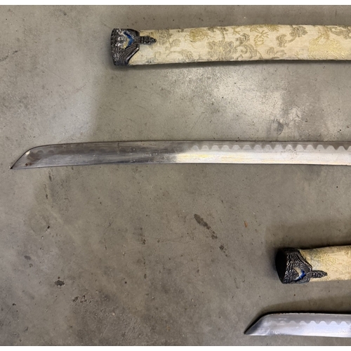 152 - A pair of Japanese decorative swords