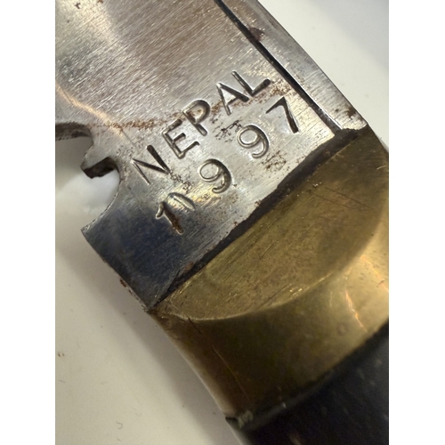 155 - A Nepalese kukri knife with patent leather scabbard (Nepal 1997 on blade)