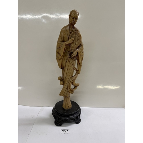 157 - A Chinese resin figurine of a scholar / gentleman
