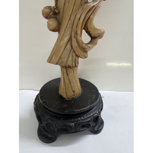 157 - A Chinese resin figurine of a scholar / gentleman