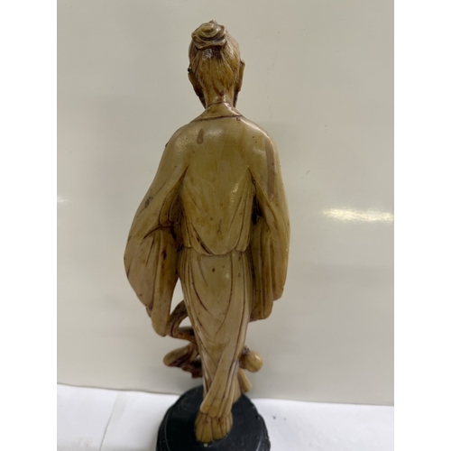 157 - A Chinese resin figurine of a scholar / gentleman