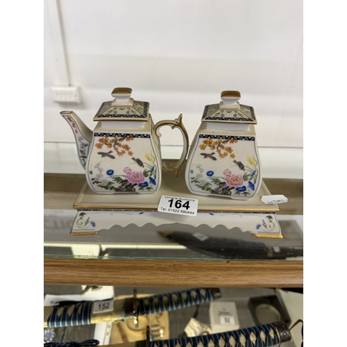 164 - A Franklin Mint birds & flowers of The Orient tea set with teapot, creamer & base