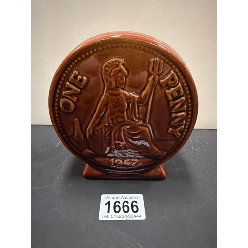 1666 - A vintage ceramic money box modeled as a large 1967 one penny coin