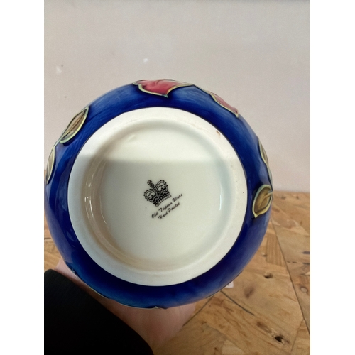 1713 - An Old Tupton ware vase with spring bouquet design 20cm