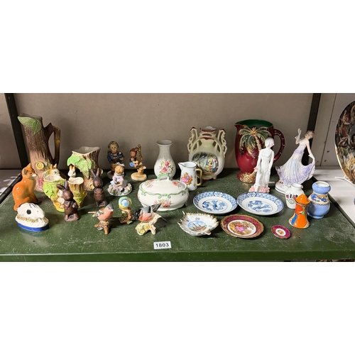 1803 - A large quantity of porcelain figures, vases etc including Beswick birds, Royal Winton etc