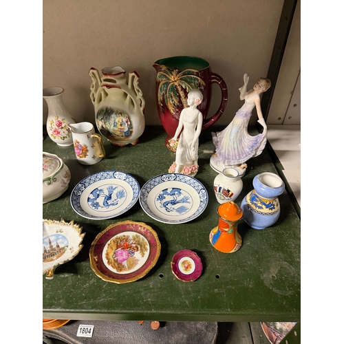 1803 - A large quantity of porcelain figures, vases etc including Beswick birds, Royal Winton etc