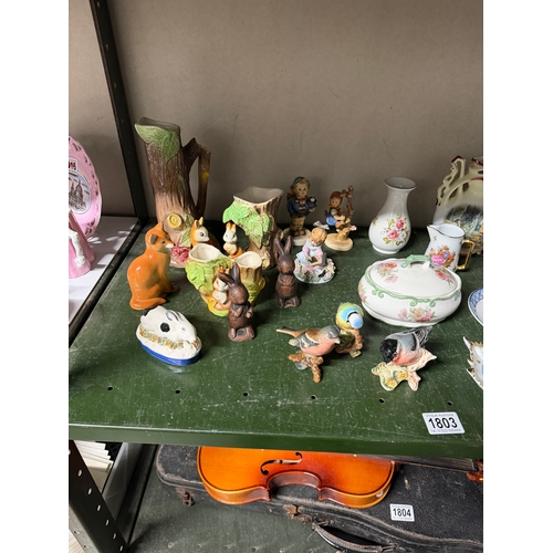 1803 - A large quantity of porcelain figures, vases etc including Beswick birds, Royal Winton etc