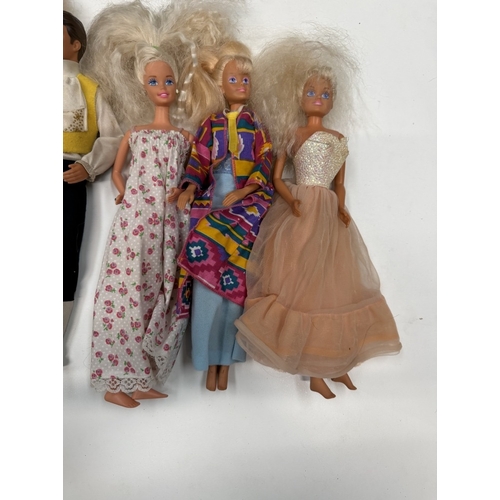 722 - 9 Barbie Dolls with clothing