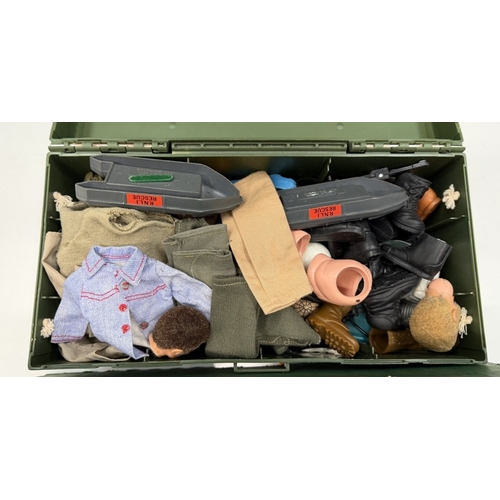 748 - An Action Man kit box & contents including body parts, clothing, accessories etc