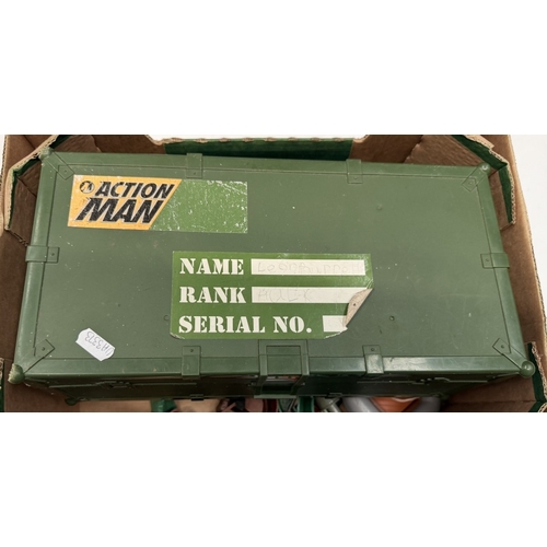 748 - An Action Man kit box & contents including body parts, clothing, accessories etc
