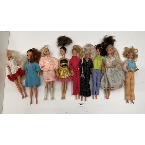 751 - 9 Barbie dolls with clothing