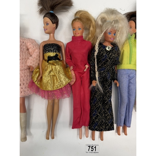 751 - 9 Barbie dolls with clothing
