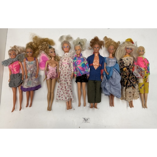 761 - 9 Barbie dolls with clothing