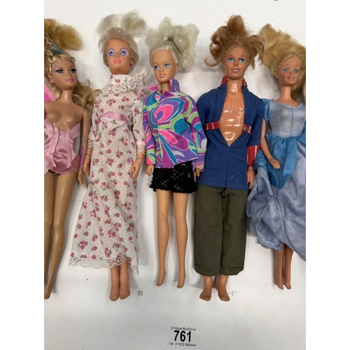 761 - 9 Barbie dolls with clothing