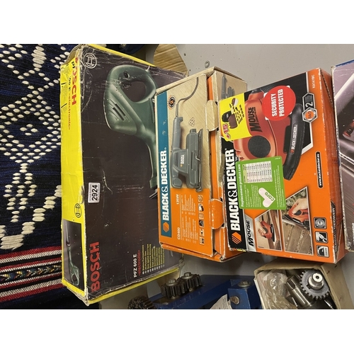2924 - A boxed Bosch reciprocating saw, sander etc