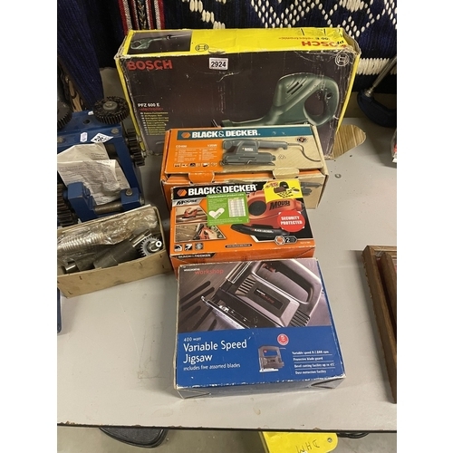 2924 - A boxed Bosch reciprocating saw, sander etc