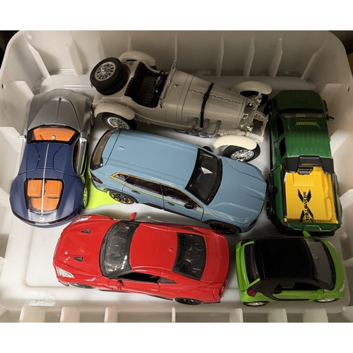 804 - A quantity of 1:18 scale diecast models including Burago Mercedes Benz ssk 1928 & some battery opera... 