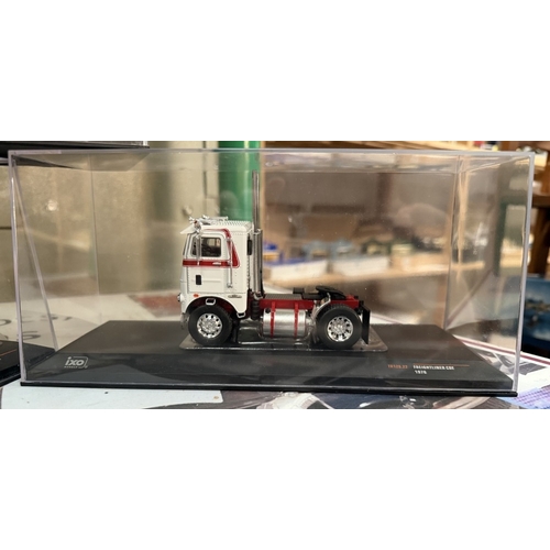 812 - 3 1:43 scale diecast truck models by IXO models including 1976 Freightliner COE truck, 1960 Dodge LC... 