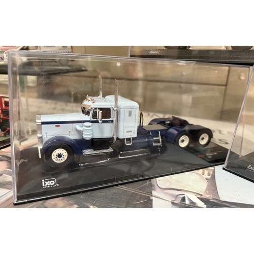 812 - 3 1:43 scale diecast truck models by IXO models including 1976 Freightliner COE truck, 1960 Dodge LC... 