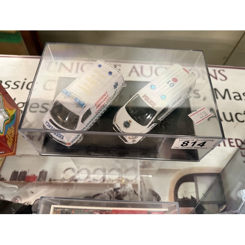 814 - 2 Emergency vehicle models in acrylic display case including 1:43 scale Cararama Ford Transit Ambula... 