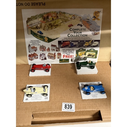 839 - A Brooklands self assembly cardboard village with cars (Unchecked for completeness)
