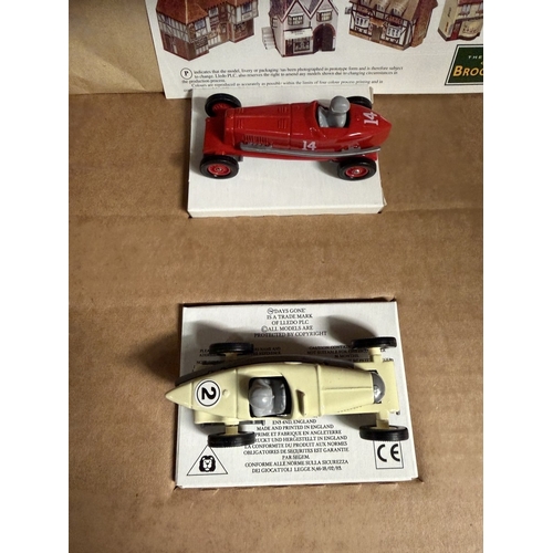 839 - A Brooklands self assembly cardboard village with cars (Unchecked for completeness)