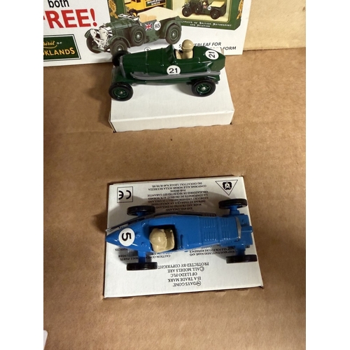 839 - A Brooklands self assembly cardboard village with cars (Unchecked for completeness)