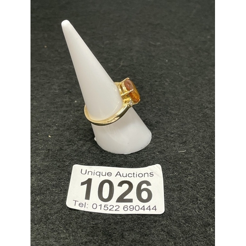 1026 - An 18ct gold citrine and diamond ring size O (total weight 5.4g)