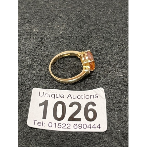 1026 - An 18ct gold citrine and diamond ring size O (total weight 5.4g)