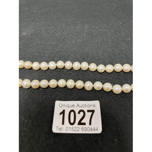 1027 - A set of pearls with 9ct pearl ball and clasp (clasp af)